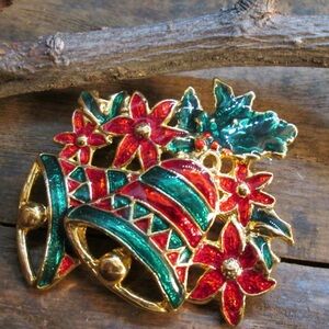 Vintage golden tone bell and poinsettia brooch
